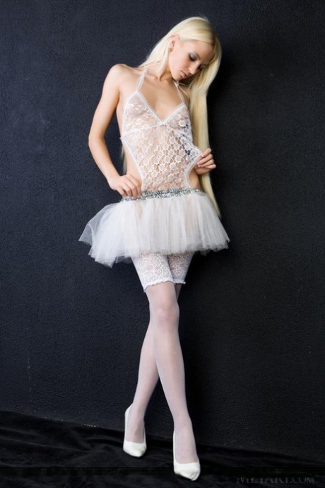 Slim blonde babe Alysha A strips out of her revealing ballerina dress