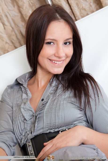 Cute young chick with a nice ass Karina reveals her tight pussy