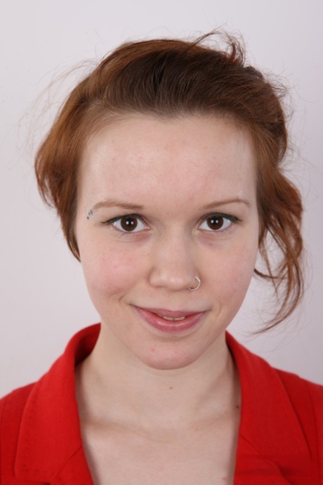 Natural redhead Klara gets completely naked before a close-up of her pussy