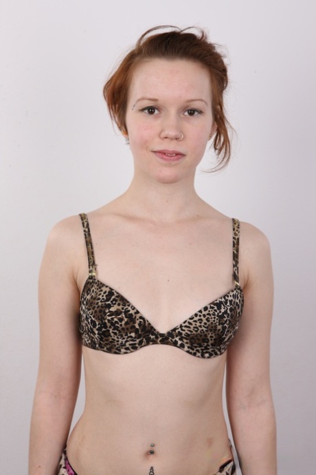 Natural redhead Klara gets completely naked before a close-up of her pussy