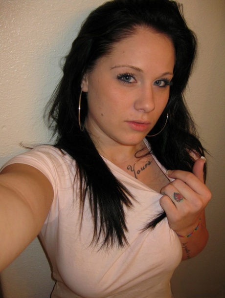 Kinky amateur Mia takes a photo of her massive natural tits in the mirror