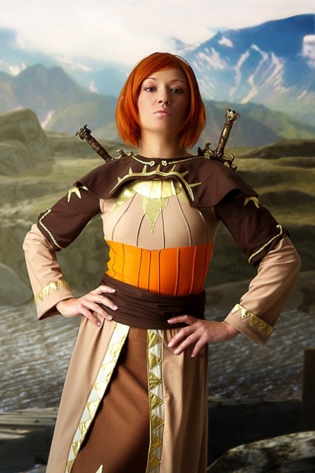Redheaded girl exposes her hard body while wearing cosplay clothing