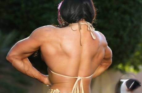 Bodybuilder Angela Salvagno flexes her muscles in Native American clothing