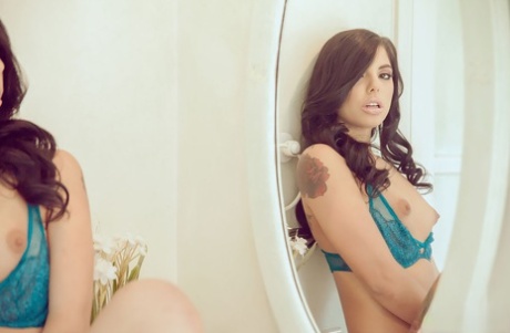 Young Latina Gina Valentina frees her pink pussy from sensual lingerie
