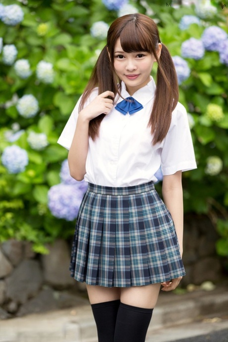 Cutie Japanese schoolgirl in pigtails shows naked ass in no panties upskirt