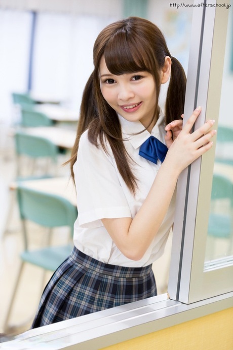 Cutie Japanese schoolgirl in pigtails shows naked ass in no panties upskirt