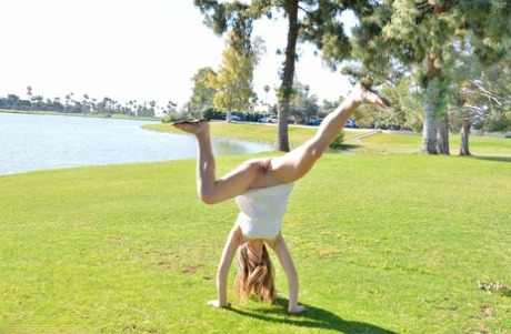 Young solo girl Lacey displays a no panties upskirt in the park