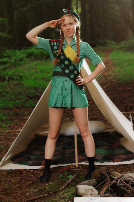 Redheaded Girl Scout Dolly Little gets naked outside her tent in beret