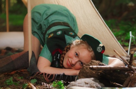 Redheaded Girl Scout Dolly Little gets naked outside her tent in beret