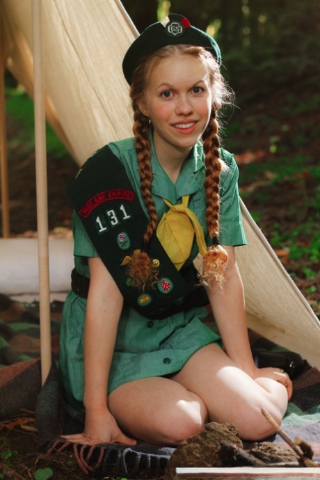 Redheaded Girl Scout Dolly Little gets naked outside her tent in beret