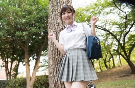 Cutie Asian girl lifts her uniform skirt to flash panty upskirt and show pussy