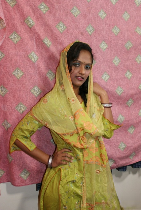 Indian girl slips off her clothes and lingerie for nude modeling debut