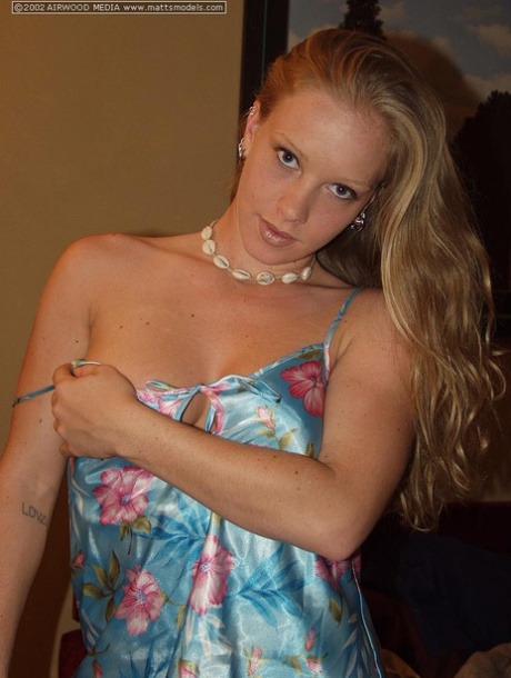 Natural blonde Cali uncovers her firm tits as she she gets totally naked