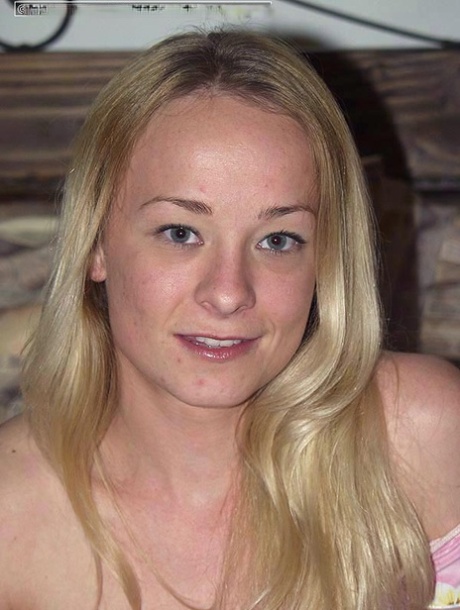 Blond amateur Eliza removes a tube top and matching leggings to get naked