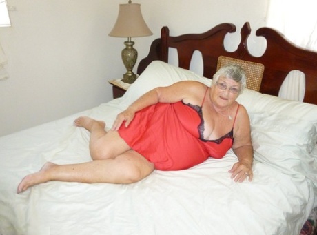 Old British woman Grandma Libby removes lingerie while toying her snatch