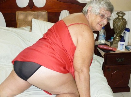 Old British woman Grandma Libby removes lingerie while toying her snatch