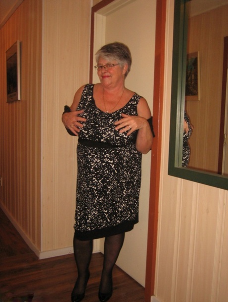 Chubby granny Girdle Goddess gets naked with her pantyhose pulled down