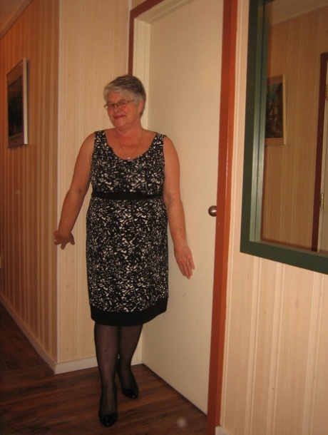 Chubby granny Girdle Goddess gets naked with her pantyhose pulled down
