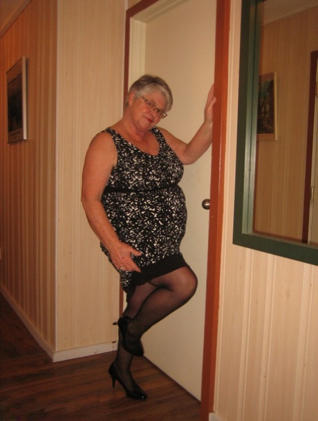 Chubby granny Girdle Goddess gets naked with her pantyhose pulled down