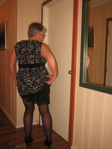 Chubby granny Girdle Goddess gets naked with her pantyhose pulled down