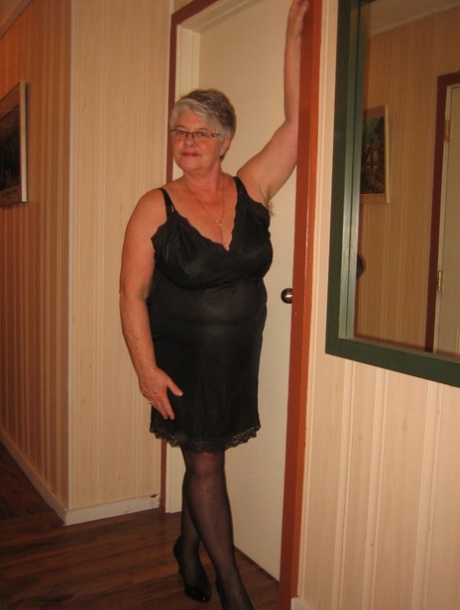Chubby granny Girdle Goddess gets naked with her pantyhose pulled down