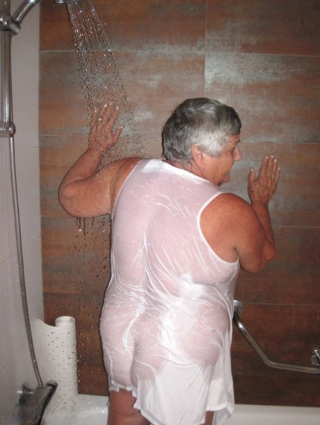 Obese amateur Grandma Libby blow drys her hair after taking a shower