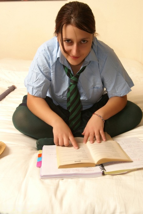 Naughty schoolgirl Kimberly Scott reading smut & masturbating her teen pussy