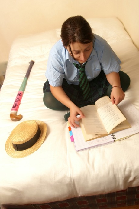 Naughty schoolgirl Kimberly Scott reading smut & masturbating her teen pussy