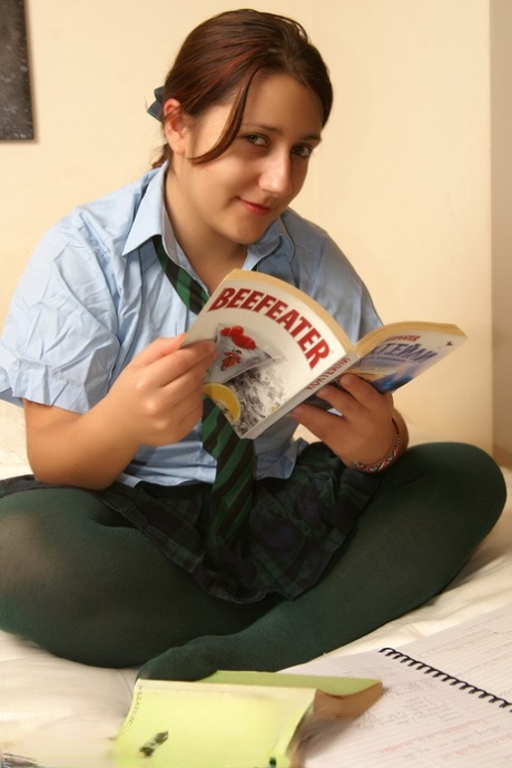 Naughty schoolgirl Kimberly Scott reading smut & masturbating her teen pussy