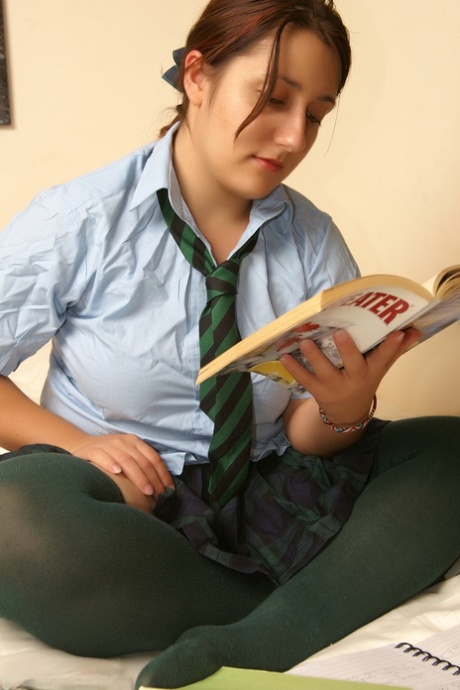Naughty schoolgirl Kimberly Scott reading smut & masturbating her teen pussy