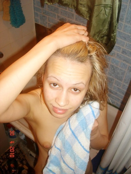 Barely legal blonde sucks her guy's large cock after taking a shower