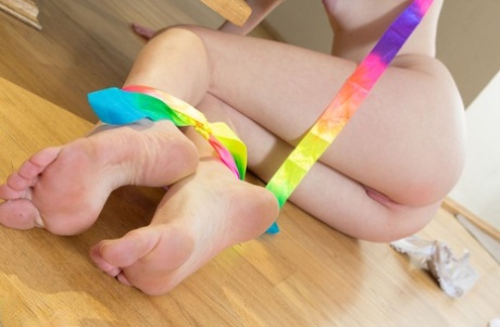Teen first timer Ariel wraps herself in a ribbon while getting totally naked