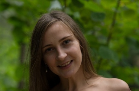 Nice teen Alexandra F gets completely naked while in a forest