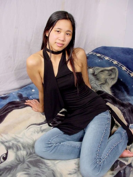 Young Chinese girl with tiny tits shows her shiny ass and naked pussy at once
