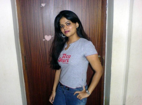 Petite Indian girl uncups big naturals after removing blue jeans