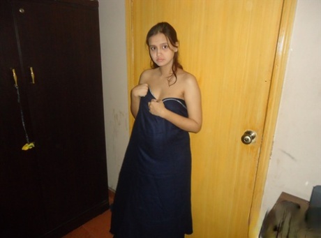 Pretty Indian wife gets naked for self shots with her husband in bedroom