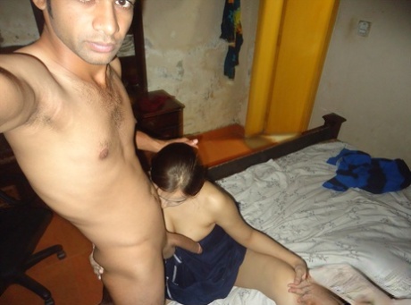 Pretty Indian wife gets naked for self shots with her husband in bedroom