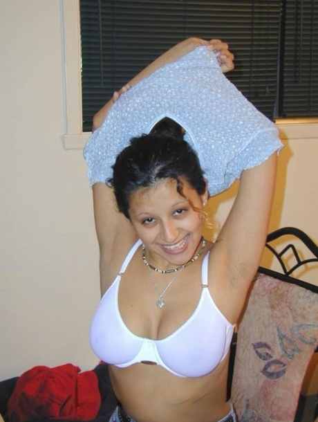Lesbian girls 69 on a bed while prepping for a strapon cock
