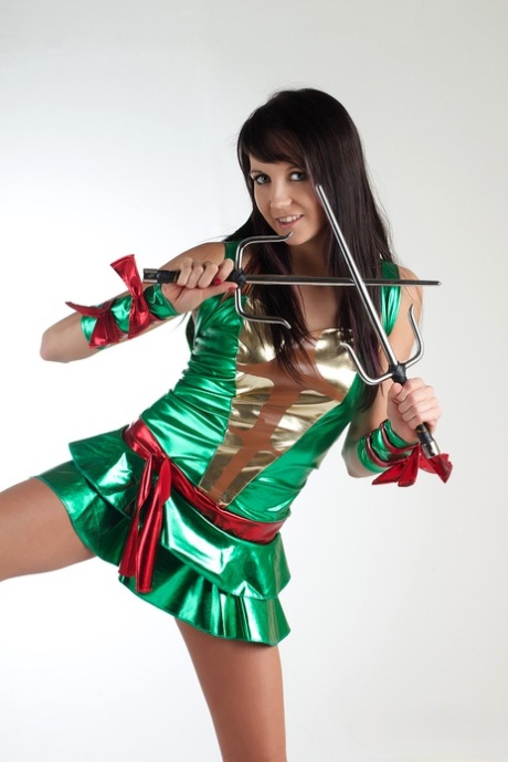 Brunette amateur Andi Land shows her shaved pussy in cosplay clothing