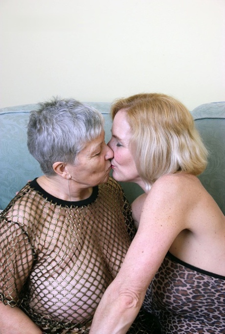 Old women proceed to have lesbian sex on a couch in lingerie and hosiery