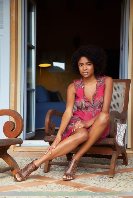Black teen Luna C spreads her long legs while showing her tight ass and pussy
