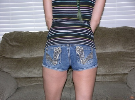 Amateur girl Natalie wears her hair in braided pigtails for her nude debut