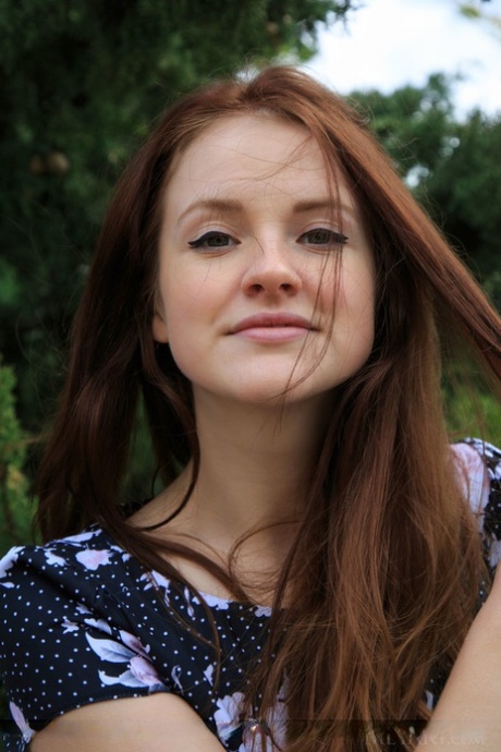 Young redhead Alice May showcases her tight slit on wooden stairs outdoors