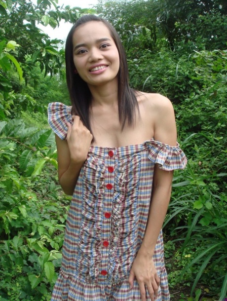 Young Asian girl gets in a vehicle after baring her tits and twat amid bushes