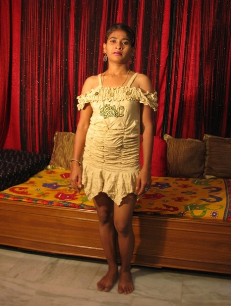Indian girl Suman has lotion rubbed into her bare breasts by her boyfriend