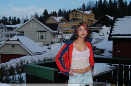 Sexy Indian teen poses on snow-covered ground before going nude on a bed