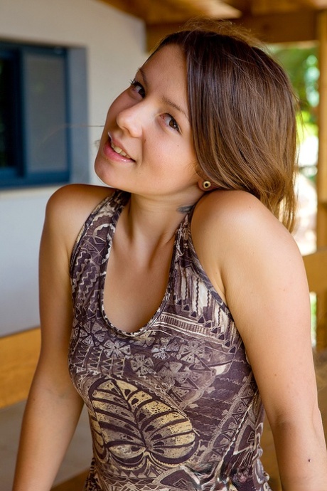 Young looking girl exposes her small tits and ass during a solo engagement