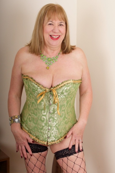 British granny Speedy Bee pleasures her pussy in lingerie and fishnets