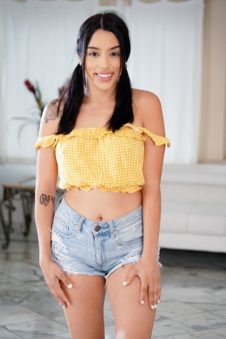 Dark haired latina teen strips down to her flat shoes while sporting pigtails