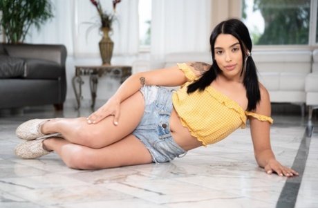 Dark haired latina teen strips down to her flat shoes while sporting pigtails